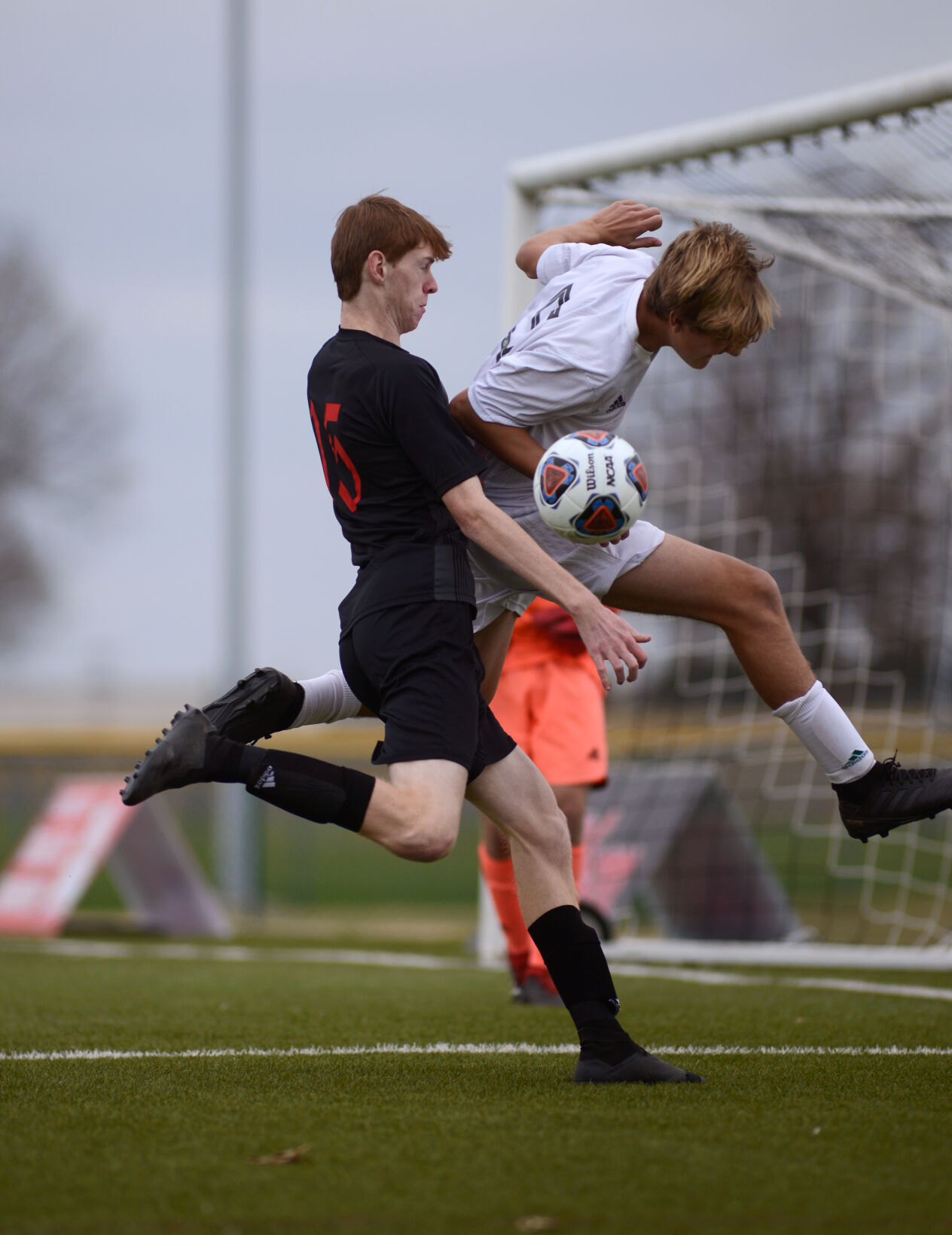Southern Boone forward Landon Beeson challenges Whitfield midfielder Kaeden Anderson for the ball